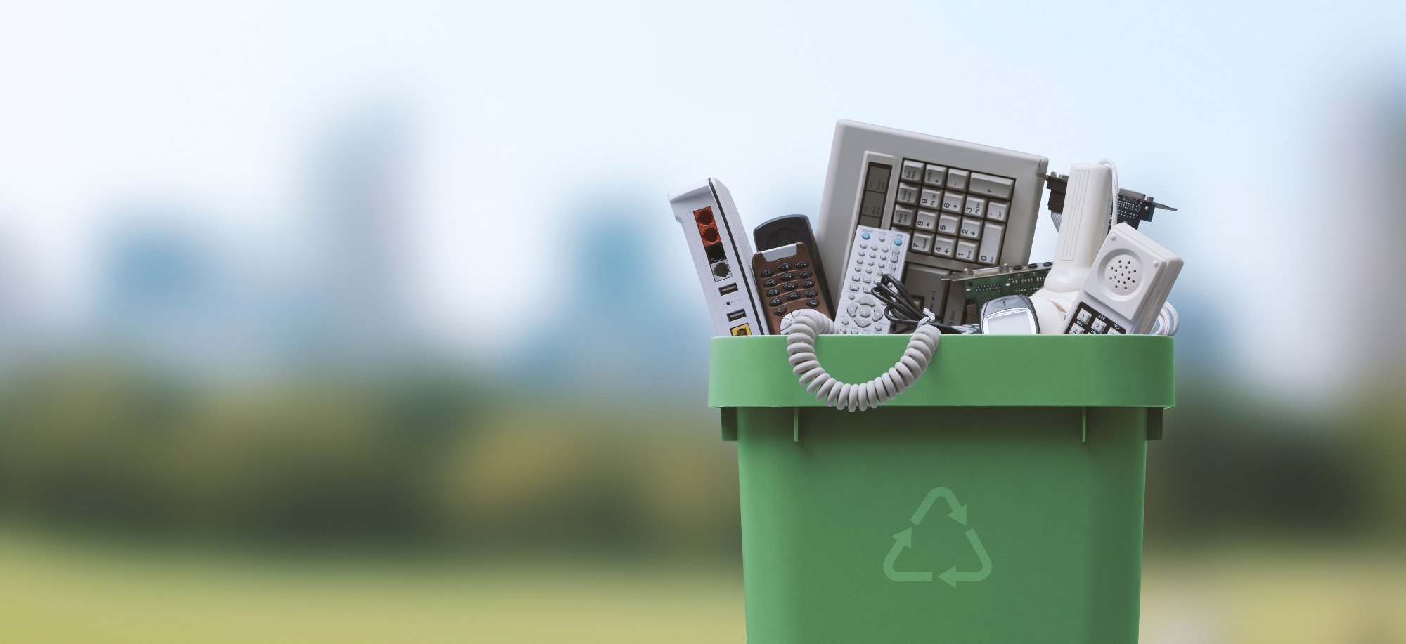 Waste bin full of electronics, e-waste and recycling concept