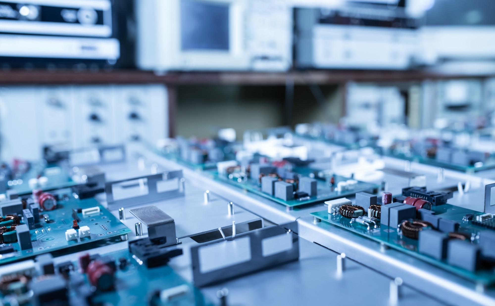 Close-up view of electronic circuit boards with various components, showcasing intricate details of power electronics or energy storage systems used in applications like supercapacitors or hybrid energy storage devices.