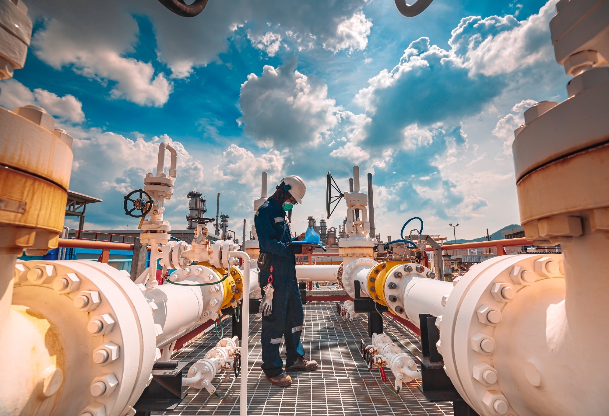 a worker checking for gas leaks