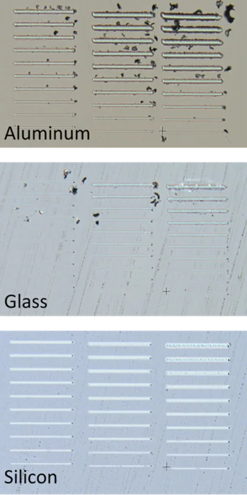 The diamond scribe can mark materials over a wide range of hardness values, including aluminum (top), glass (center) and silicon (bottom).
