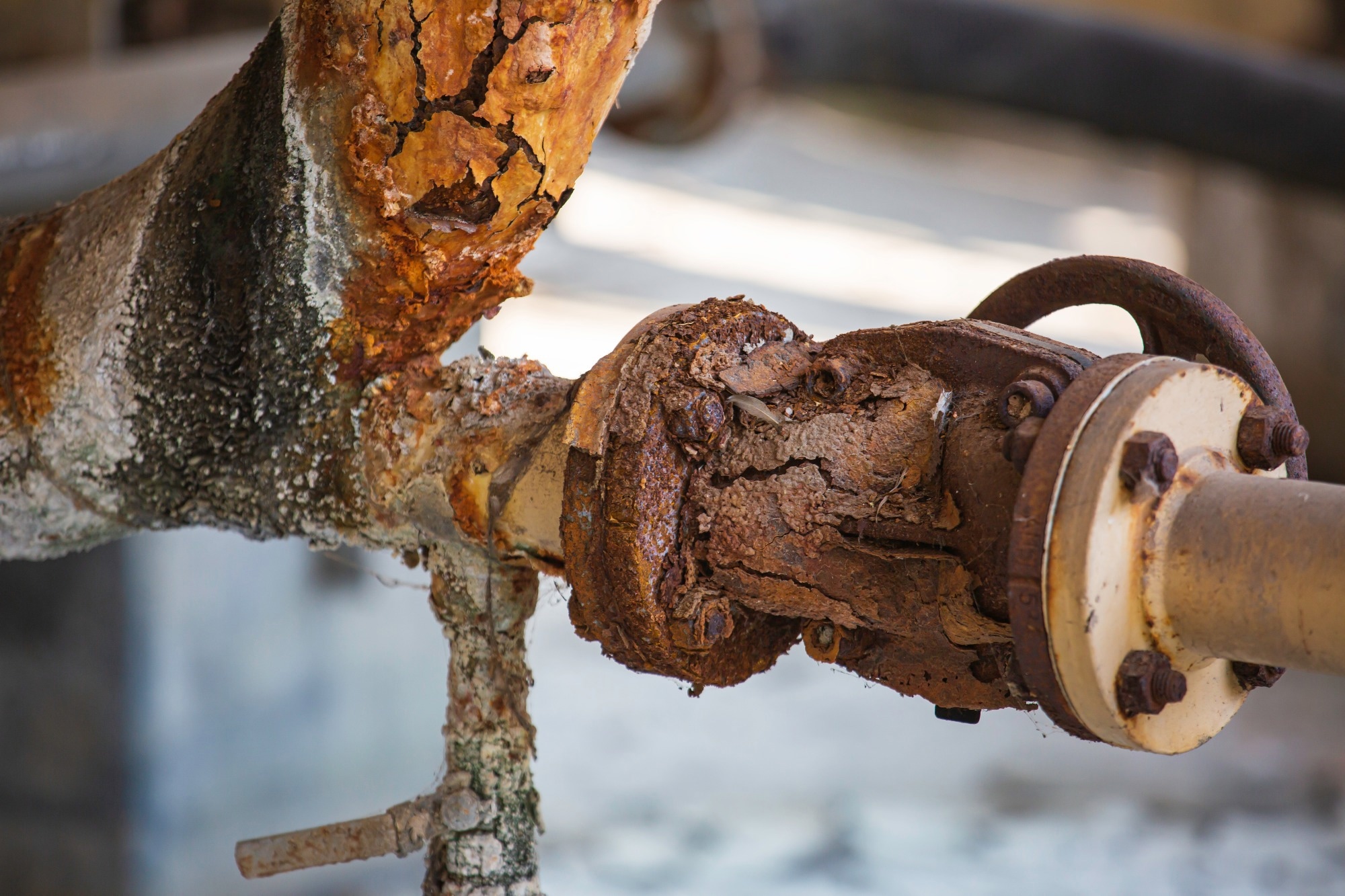 A steel pipe has corroded so much it is no longer usable.