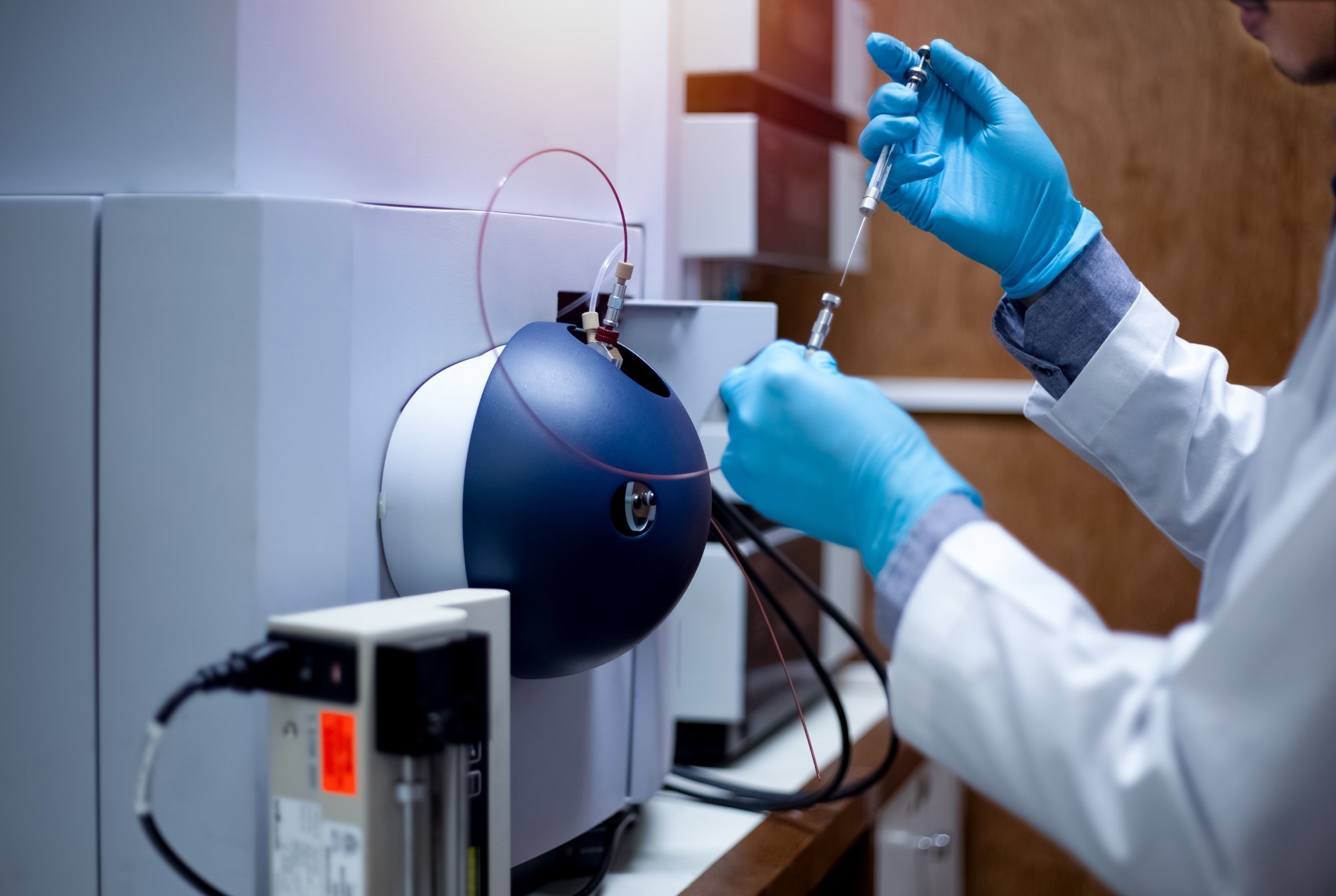 A scientist adding a sample for TOF spectrometer analysis. Positron Annihilation Spectroscopy