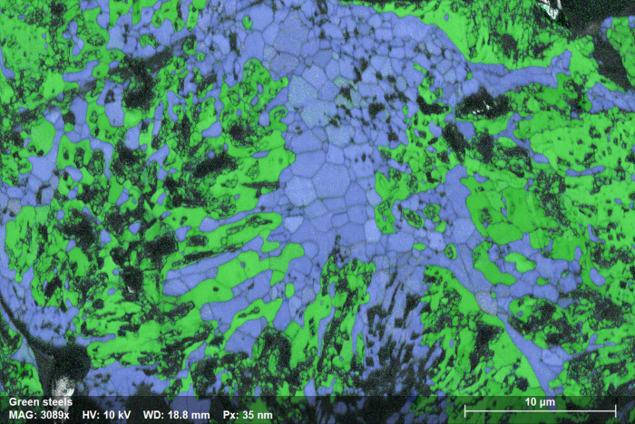 Phase map showing the distribution of Magnetite (blue) and Ferrite (green) in a Hematite pellet sample following hydrogen reduction for 20 minutes. eWARP was used to study the microstructural evolution of this sample over the reduction process