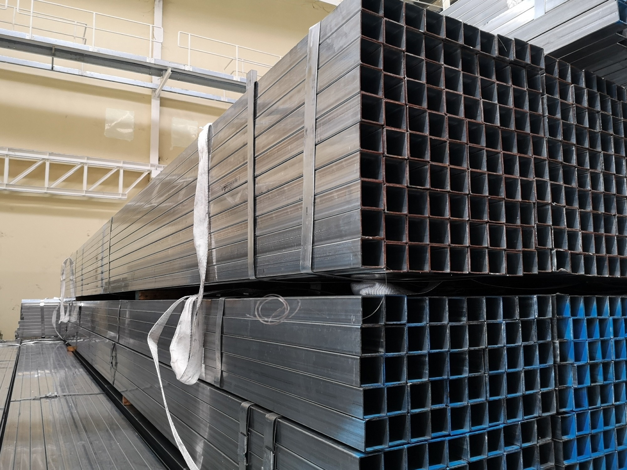 stack? of? galvanize?d? square? steel? pipes? for? construction? supplies?