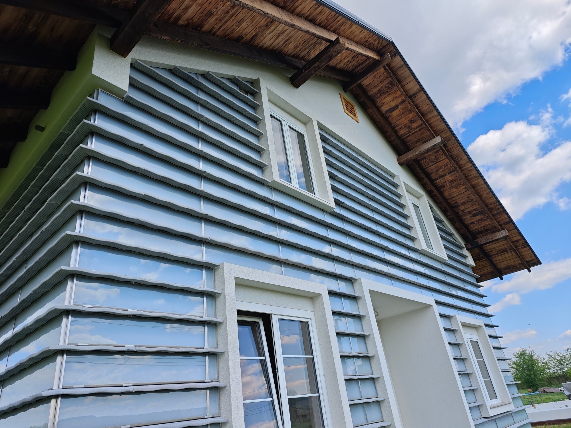 Modern House with Aerogel Panel Façade – Passive Solar Heating Innovation Description: Contemporary energy-efficient home featuring an advanced façade system made with aerogel-based translucent panels