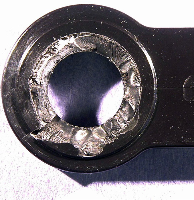 The failed bracket fracture surfaces exhibited features that are characteristic of environmental stress cracking (ESC)