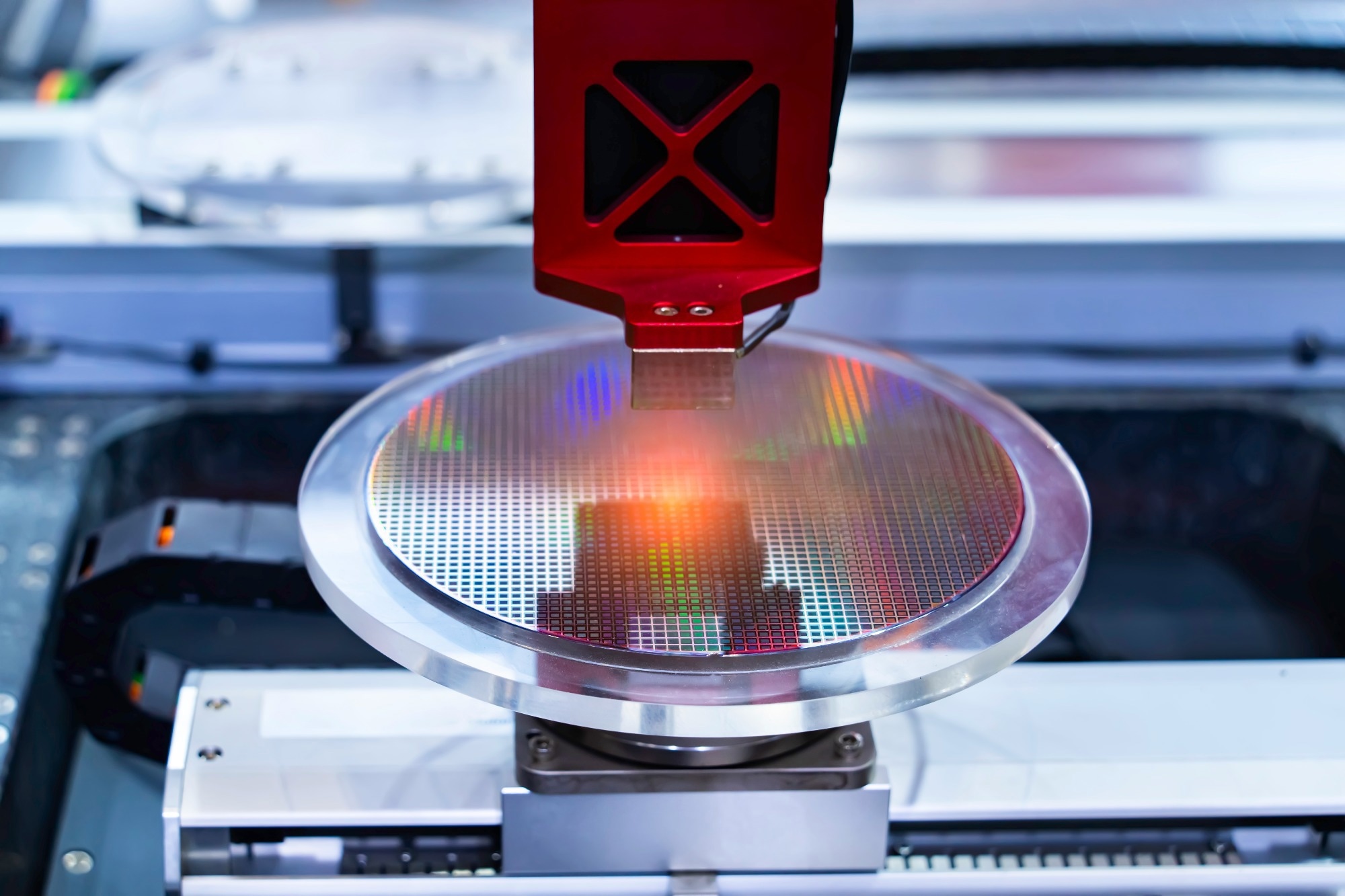 Semiconductor and Computer Chip Manufacturing at Fab or Foundry with robotic arms with silicon wafers.