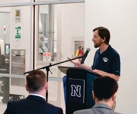 Dr. Renzas giving a talk at a university.