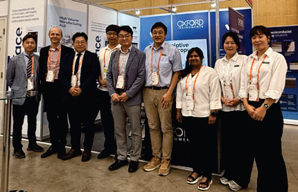 Images from ICSCRM 2025 in Busan, South Korea. The group stands in front of their posters.