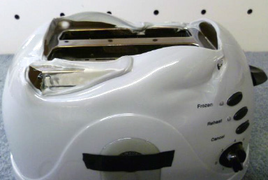 Photo of a 110 V toaster after connection to a 240 V supply.