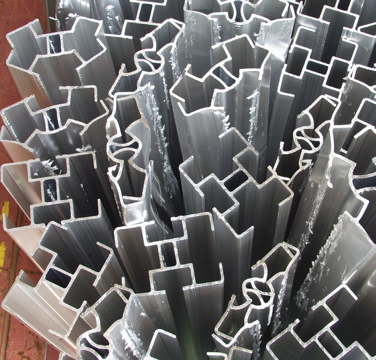 Several pieces of aluminum stacked against each other.