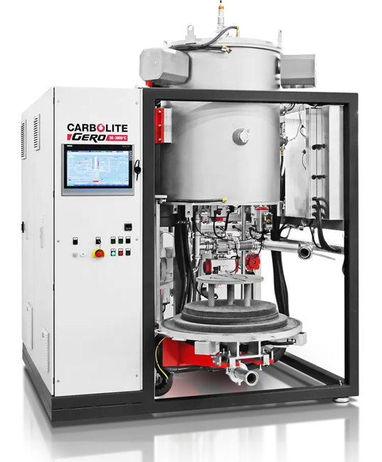 Industrial liquid silicon infiltration setup using bottom-loading graphite furnaces.