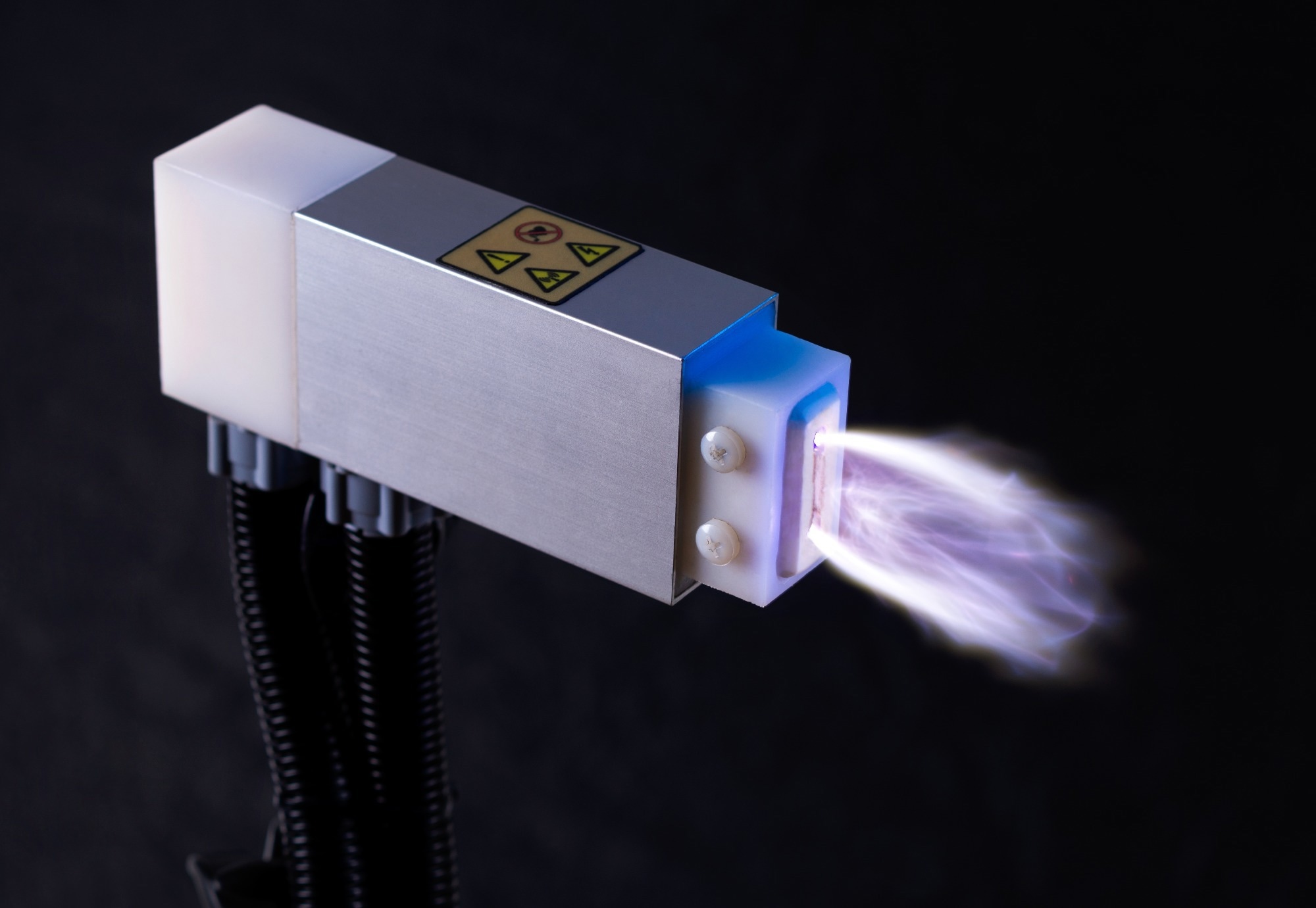 Plasma Technology for Surface Treatment. An advanced device produces a purple cold plasma ray.