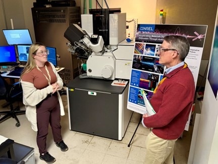 A female and male scientist in conversation