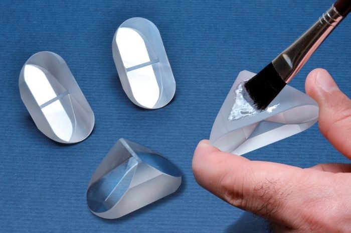 Low-outgassing adhesive