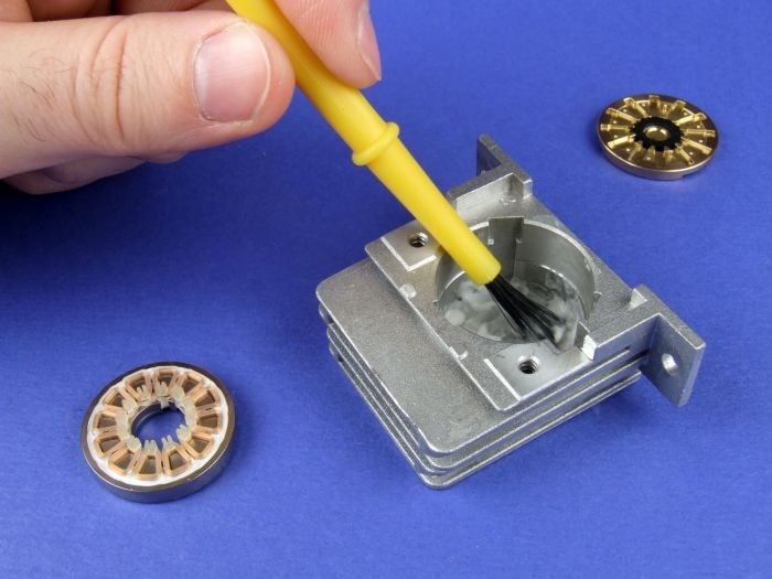 Low-outgassing adhesive