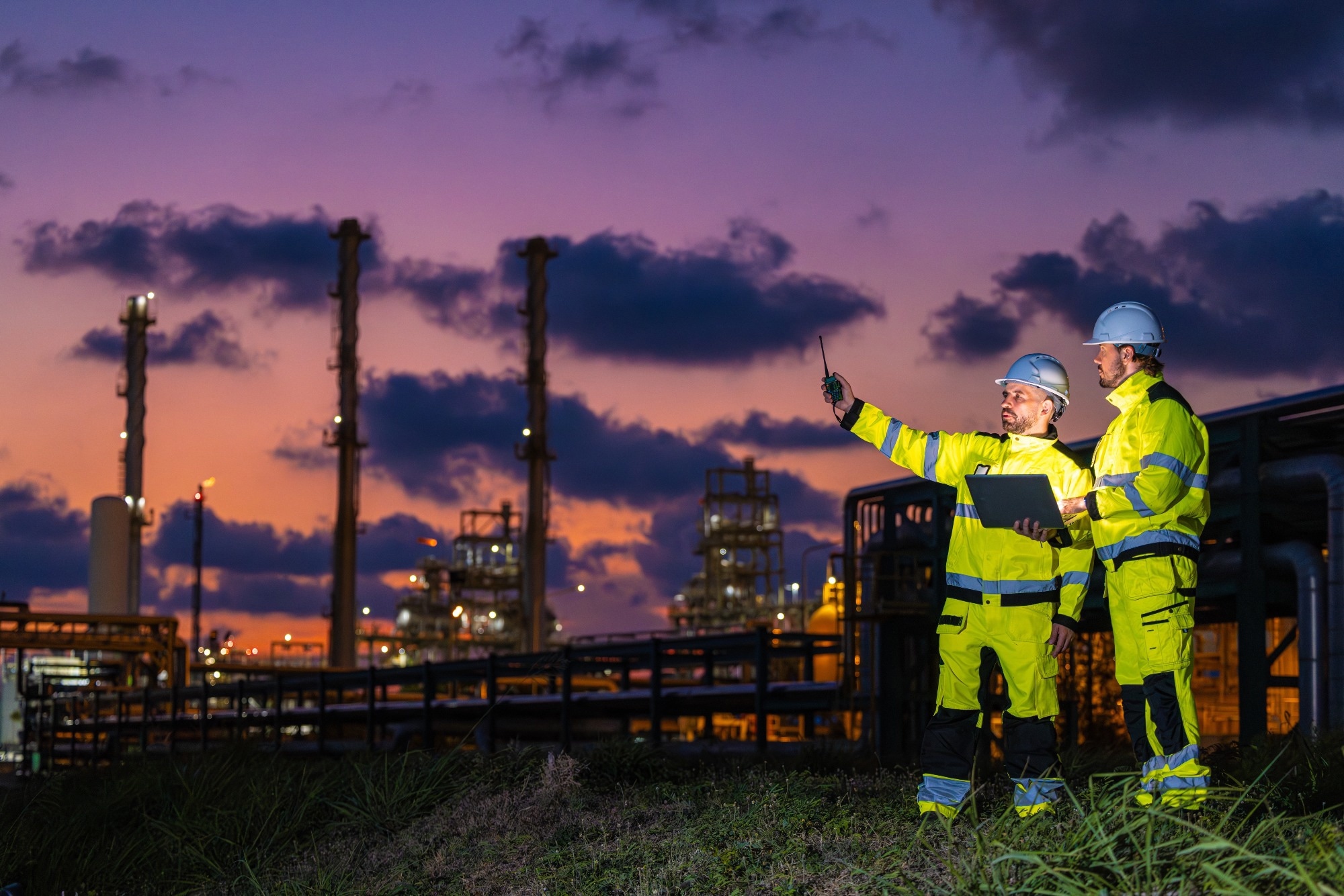 A team of engineers working on a refinery plant