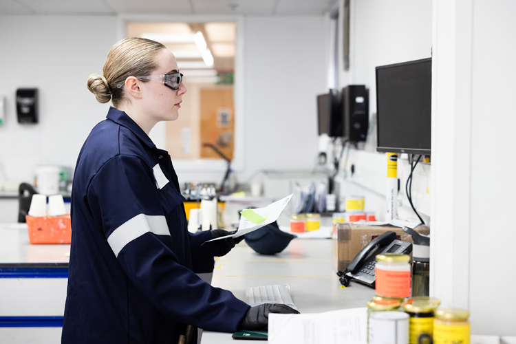 Female scientist wearing safety goggles