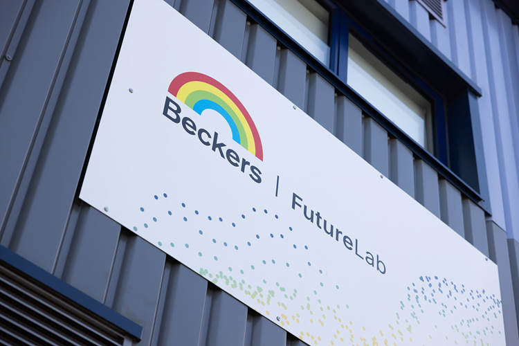 Outside of a Beckers facility, with the company logo on the outer wall.