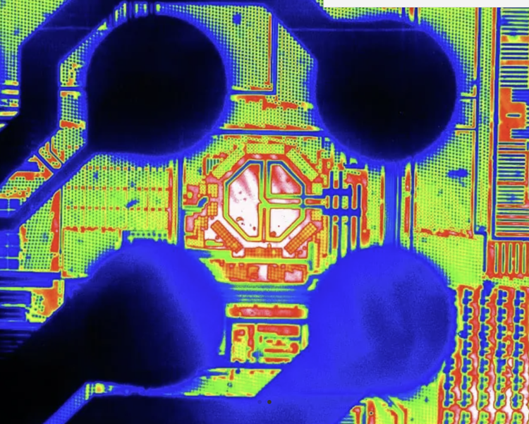 False-color SWIR image of an integrated circuit, with intensity mapped to a color scale to enhance contrast between bond pads, metal routing, and the die