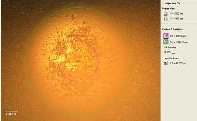 Optical micrograph of a Calotest crater showing structure.