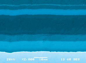 InnerArmor films can use multiple layers to achieve finely-tuned performance characteristics. This SEM photo shows a four-layer film.