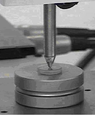 Standard fused silica specimen in position on stage ready for area function determination.