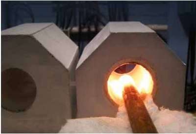 Induction heating - preheating bolts and screw heads prior to forging.