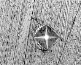 After Silver Disc (Pre-Polishing) Step: Still a large number of scratches can be seen on the surface. The Vickers hardness impression corners are not distinct.