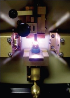 RDE Spectrometer Sample Stand Showing Oil Sample Being "Burned"