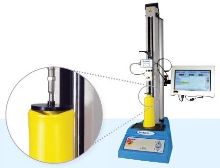 Top-load test on a PET bottle using a Multi-Test 2.5 xt top-load tester.