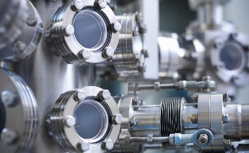 Depth-Dependent Hardness of Irradiated Steel