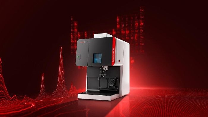 Product image of the ICP-OES with a red background overlaid with spectra, giving the impression of magnitude and scale.