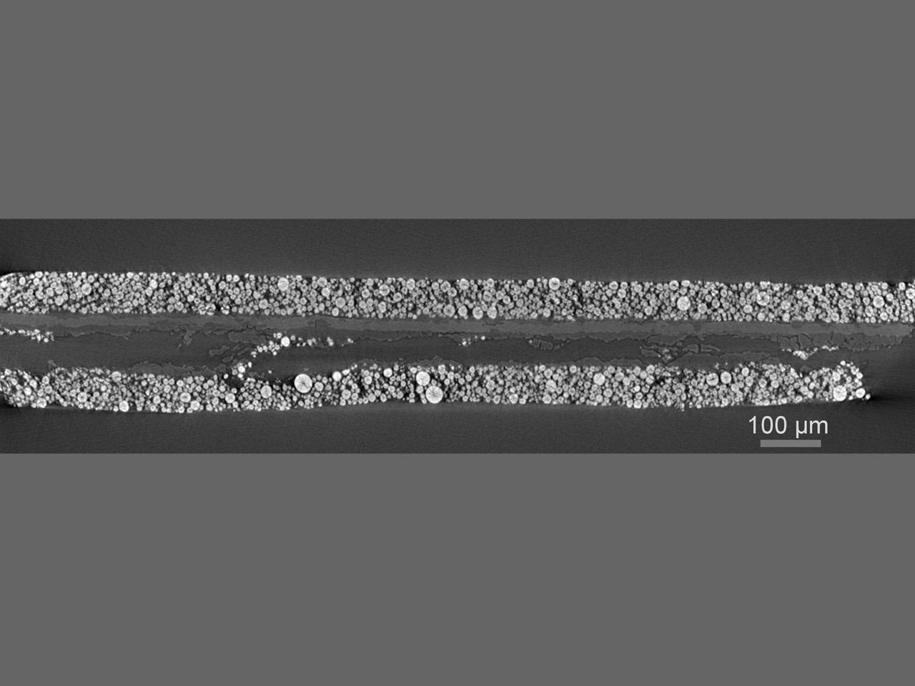 Virtual cross-section through a cycled and de-packaged lithium-ion battery, revealing damage in the current collector and cathode layers.