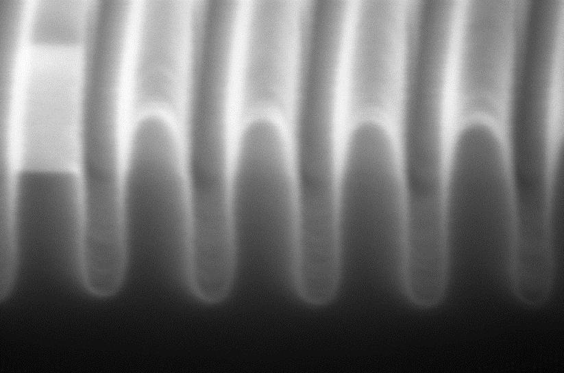 25 nm wide Si trenches etched to 110 nm depth by ALE, HSQ mask still in place.