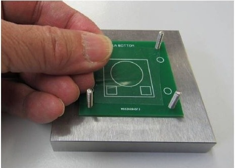 Applying non-adhesive, reusable cling film to sensor carrier