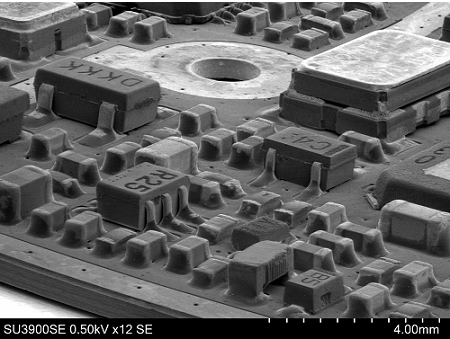Printed circuit board. The 3D shapes and positions of mounted components can be seen using low magnification/high-tilt observation