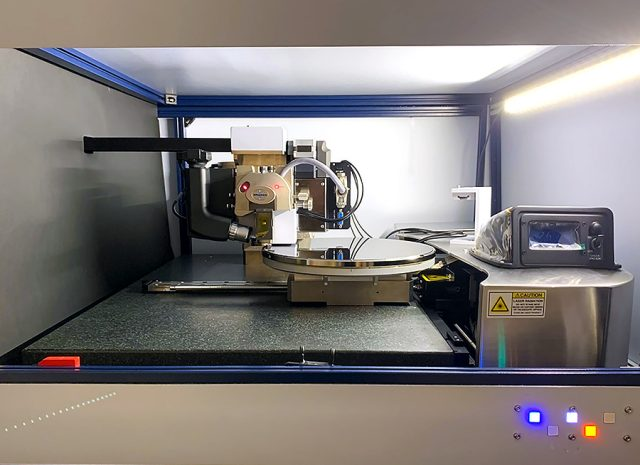 Interior view of the Dimension IconIR300 system during defect inspection of a 300 mm wafer.