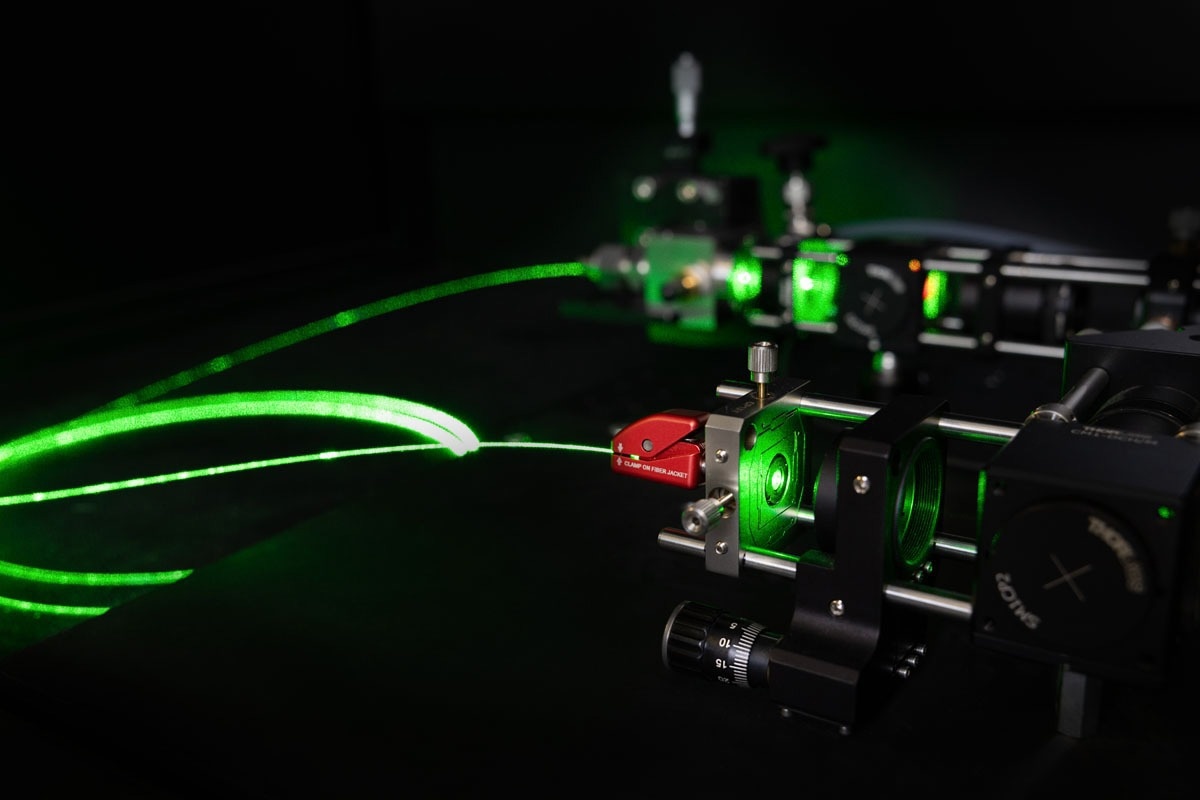 Close up of the Gas Raman Spectrometer, emitting green light.