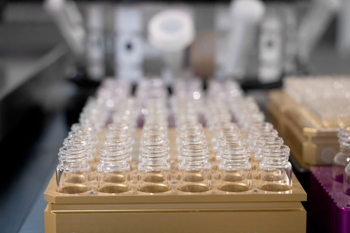 A box of glass vials in a cardboard box.