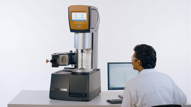 Male scientists working with the Waters TA Instruments ARES-G3 Rheometer