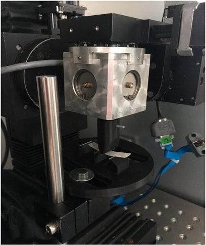 Three-point bending test of a 4D-printed specimen using the orthodontic measurement and simulation system (OMSS) at different temperatures.