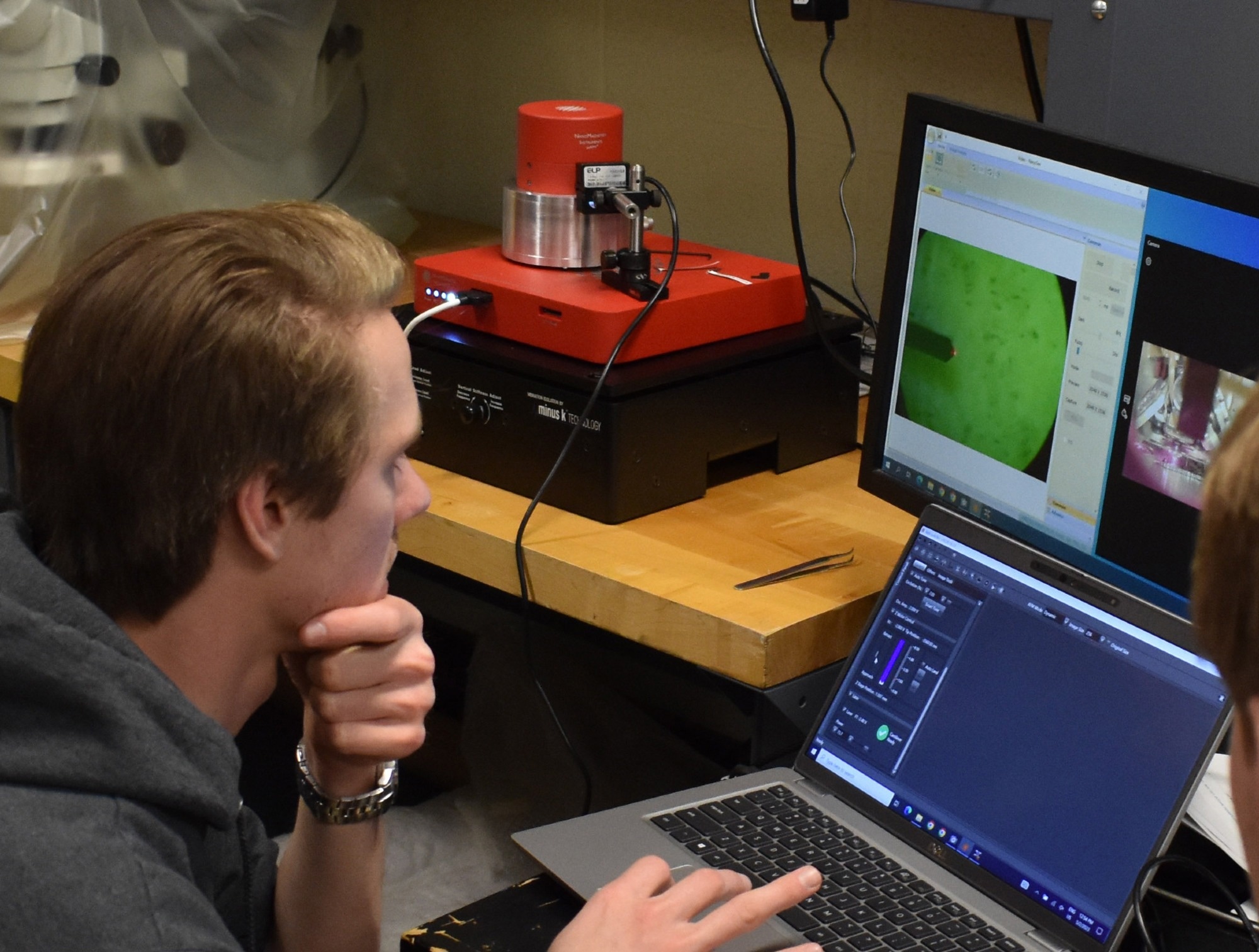 Negative Stiffness Vibration Isolation Supports Atomic Force Microscopy