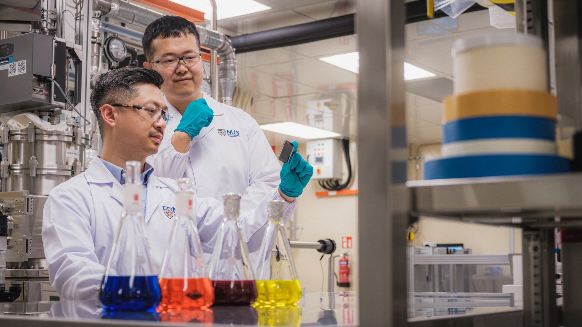 Researchers at the National University of Singapore looking at samples in the lab.