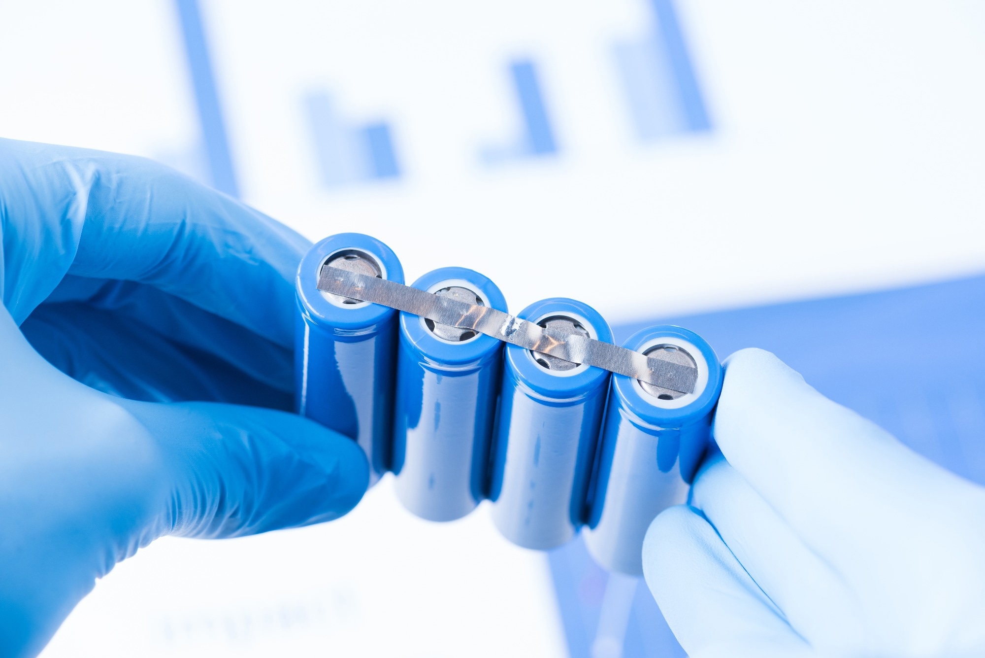 Scientist hold row of accumulators