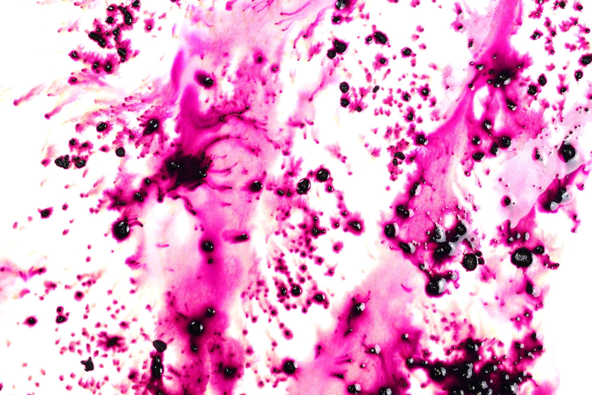 Potassium permanganate dissolved in water against a white background.