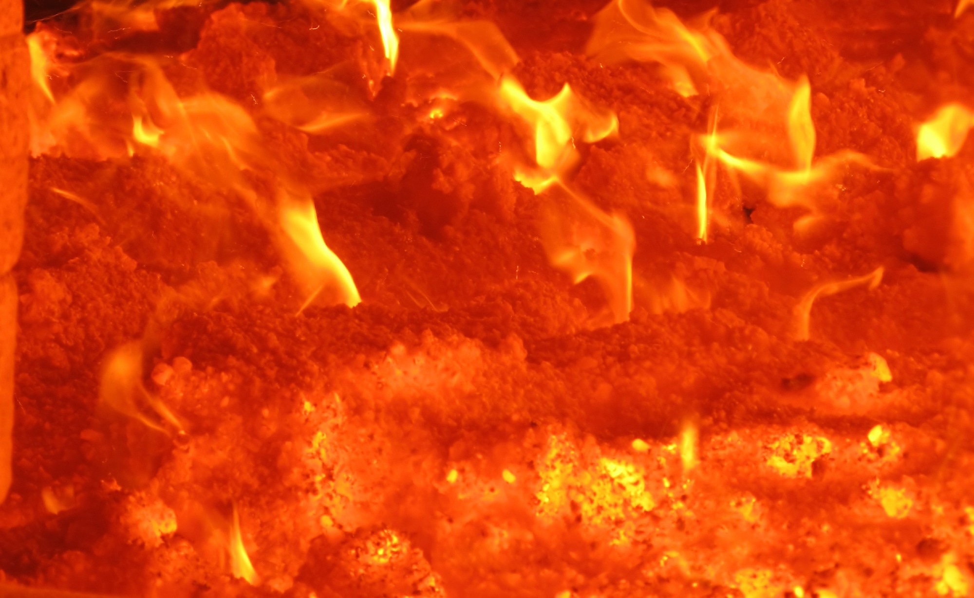 Coals burning up close image.