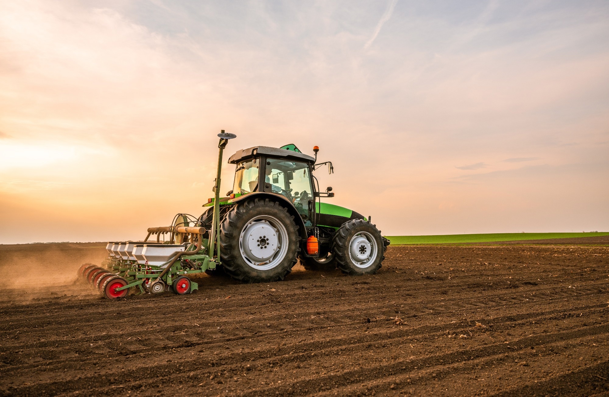 Tractor carrying out pre-planting levelling.