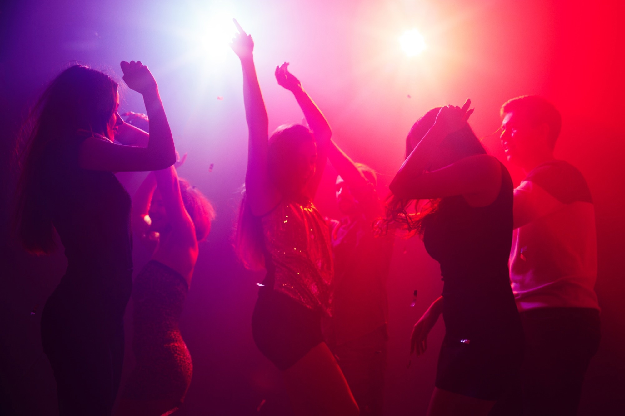 The waste energy generated by human activities could be used to power piezoelectrics. Study: Textured Lead-Free Ceramic with High Thermal Stability and Electrical Quality Factor Multiple people dancing in a nightclub drenched in red and purple lights.