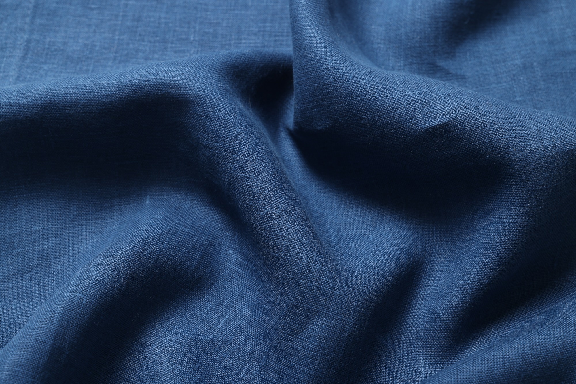Thick navy cotton scrunched to convey manipulatable magnetorheological fabric.